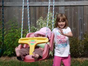 Sept 1, 2011 - Isabel pushing Sarah on a swing