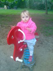 May 28/08 - Isabel riding a toy horse
